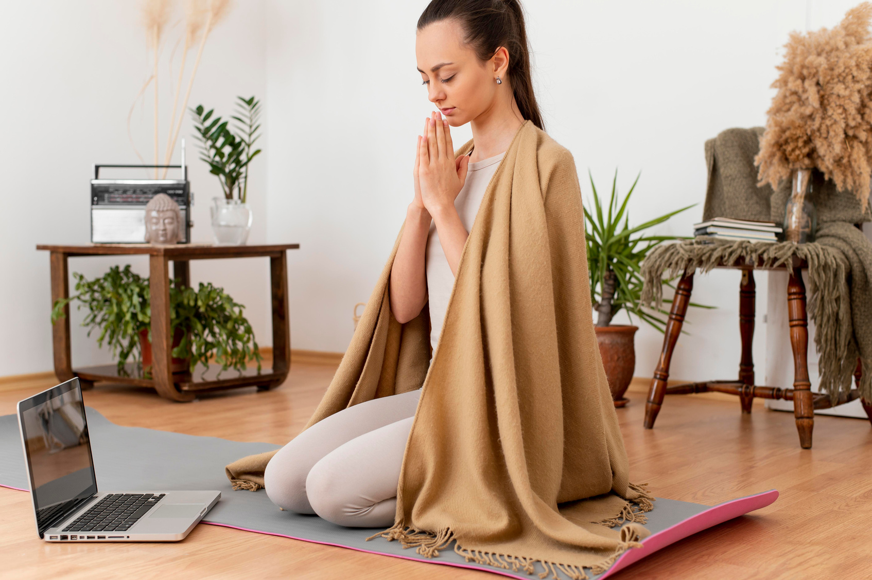 woman meditating home mat